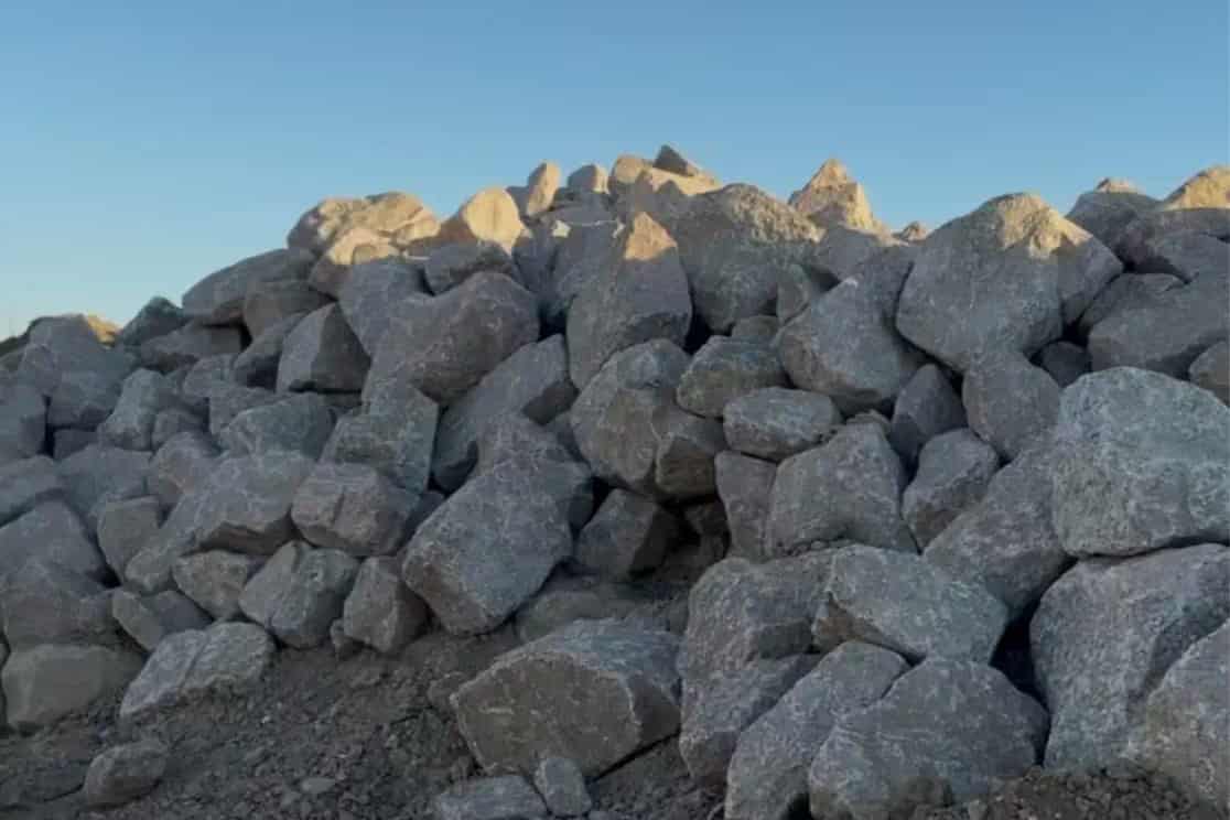 Large riprap stone stockpiled for erosion control projects in South Texas